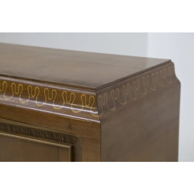 Splendid sideboard designed in the 1950s for the famous Valzania production with original label. The sideboard is entirely...