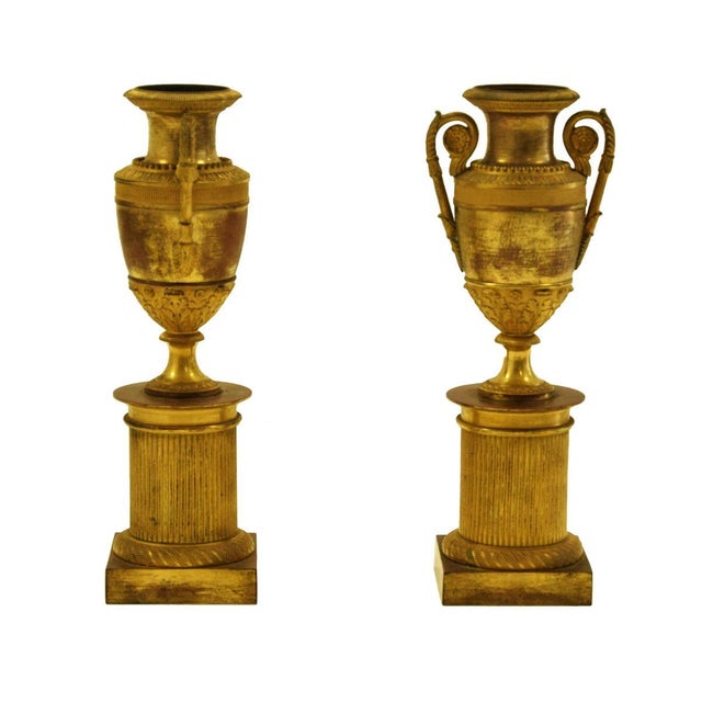 Pair of vases on plinth is an original decorative object realized in the second half of the 19th century. Original gilded...