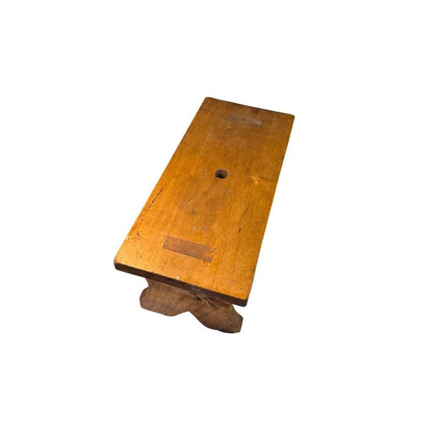 Rustic Wooden Entrance Stool also known as a milking bench, it has a rustic design with shaped legs typical of 19th or...