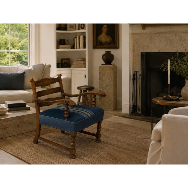 Danish Cabinetmaker, Lounge Chair or Armchair, Wool, Carved Oak, Denmark, 1920s An early lounge chair designed and...