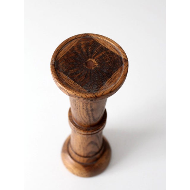 A vintage turned oak pedestal stand with a warm honey-toned finish and naturally varied wood grain. The classic, softly...