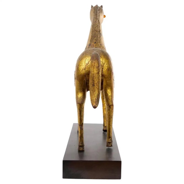 Large hand carved gilt gold wood animal sculpture horse figure with full gold leaf veneer. Intricate design and lovely...