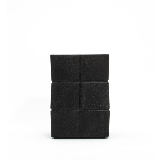 The Black Shagreen Rhomboid Waste Bin by R&Y Augousti is a masterpiece of functional design, combining luxurious materials...