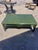 Vintage rectangular coffee table with a rich mottled green painted finish and understated chinoiserie-inspired lines. The...