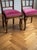 A magnificent and elegant matching pair of fully refurbished Hungarian Art Deco salon or dining chairs, featuring rich...