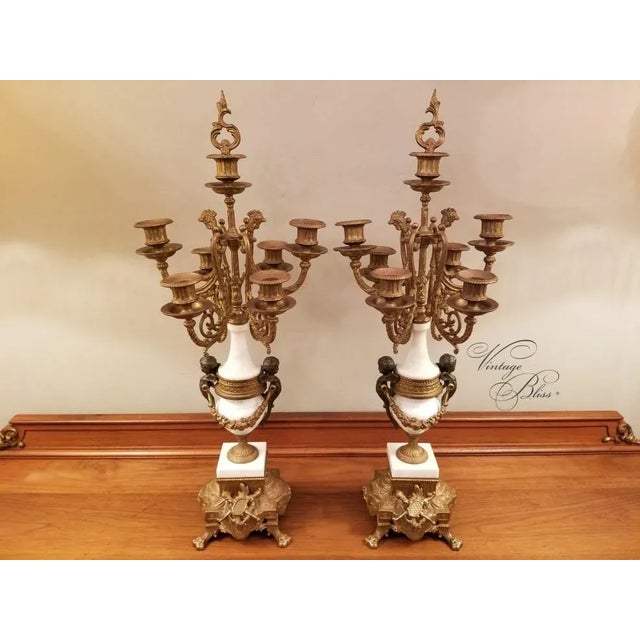 Vintage Italian Pair 7 Light Gilt Bronze & Marble Figural Cherub Candelabras A stunning vintage pair of Italian 7 light...