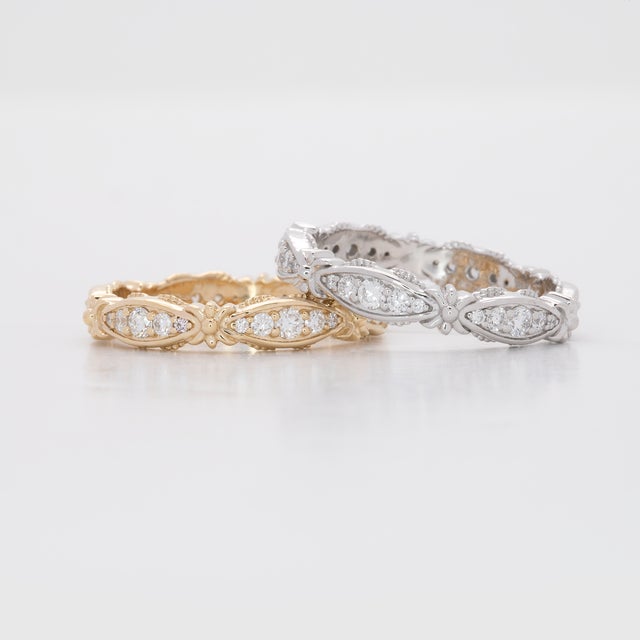 Thirty earth-mined diamonds sparkle in a continuous line across this solid 14K white gold band, totalling 0.38 carats....