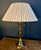 High quality, Stiffel style, brass lamp complete with its original shade and finial. The lamp showcases an urn-style base...