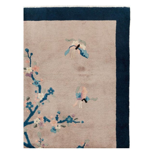 A vintage Chinese Art Deco accent rug handmade during the mid-20th century. Measures: 4' 3" x 6' 11".