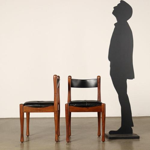 Set of 6 chairs in stained beech wood, foam padding and leather upholstery. This piece is attributed to the mentioned...