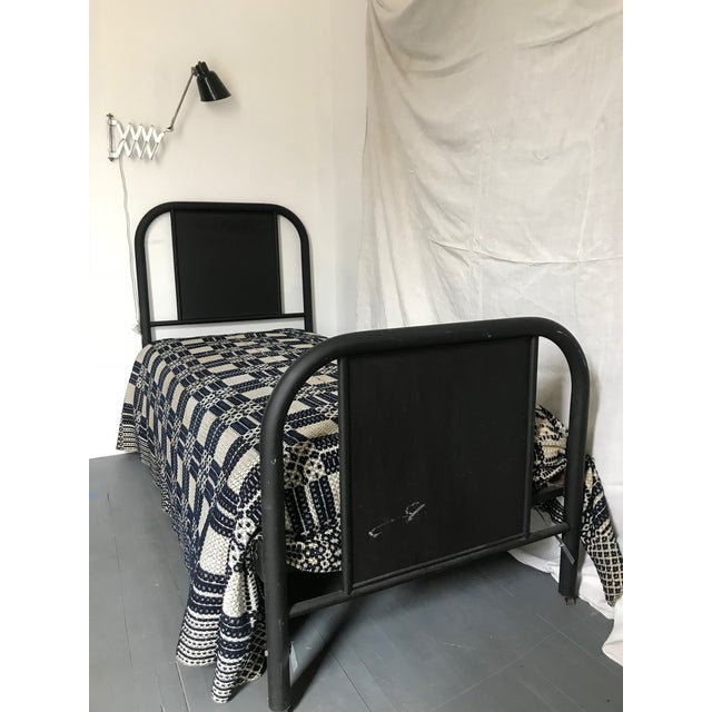 Original antique early American black metal bed.