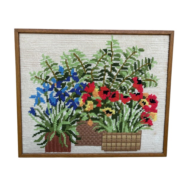 Mid century 1970s era needlepoint floral wall art. The art depicts multiple potted plants. A colorful piece of art. Framed...
