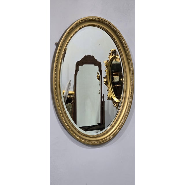 Very good quality Edwardian oval gilt wall mirror, egg and dart decoration, with original bevelled glass, in very good...