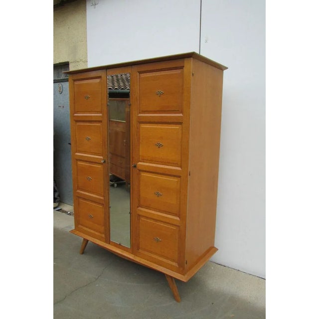 Small cupboard 2 doors, with decoration of knot interlaced out of brass. Made out of massive oak and plating, 2 functional...