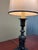 A finely detailed Neoclassical table lamp crafted entirely from solid brass. The base features ornate classical detailing...