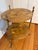 Exquisite burled walnut two tier occasional or side table by Maison Bagues. A trio of Faux Bois brass legs support the...