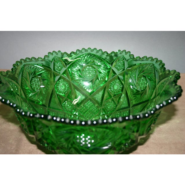 A beautiful green glass punch bowl measuring 14" across and almost 7" tall. It was made by the Imperial Glass Co. c. 1890s...