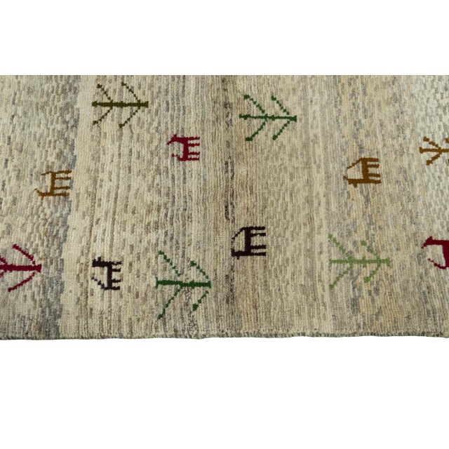 Textile Hand-Knotted Gabbeh Nomadic Rug with Natural Tones & Symbolism For Sale - Image 7 of 11