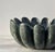 A striking sculptural sink hand-carved from luxurious Verde Guatemala marble, celebrated for its deep green tones and...
