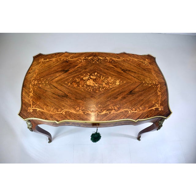 A very fine quality French rosewood Marquetry writing table desk with one drawer and working lock and key. The Serpentine...