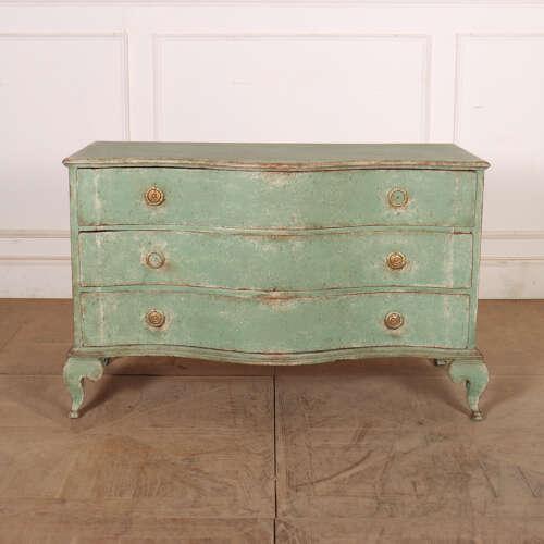 Pretty late 18th century Danish serpentine front oak commode on shaped cabriole feet. 1780. This piece is designed in the...