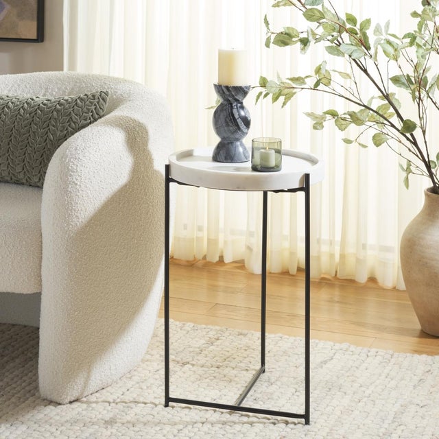 Introducing the Bavaria marble side table where elegance meets simplicity. This stunning piece features a blend of white...