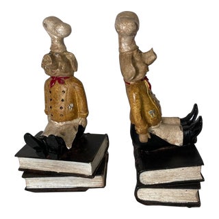 Pair of Late 20th Century Bookends: Pig Chefs Sitting Atop Antique Hardbound Books For Sale