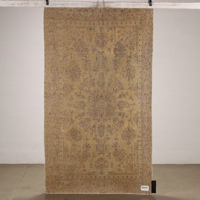 Vintage cotton and wool rug, fine knot; manual manufacturing. This piece is attributed to the mentioned designer/maker. It...