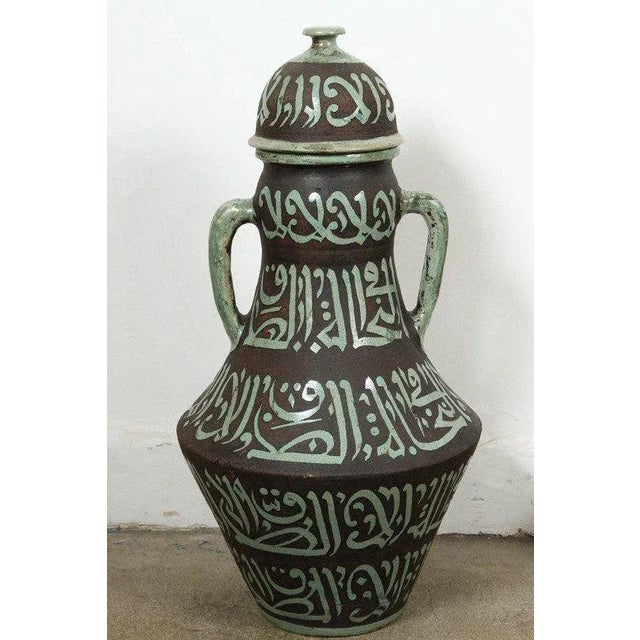Pair of vintage Moroccan green and brown ceramic urns with lid and handles. Great Moorish style handcrafted and chiselled...