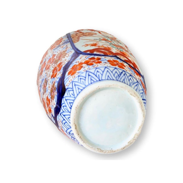 Elegant Japanese porcelain vase from the Meiji period, circa 1880, beautifully decorated in the traditional Imari palette....