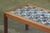 This Danish teak coffee table, adorned with exquisite ceramic tiles, is an ideal addition for post-dinner gatherings. The...