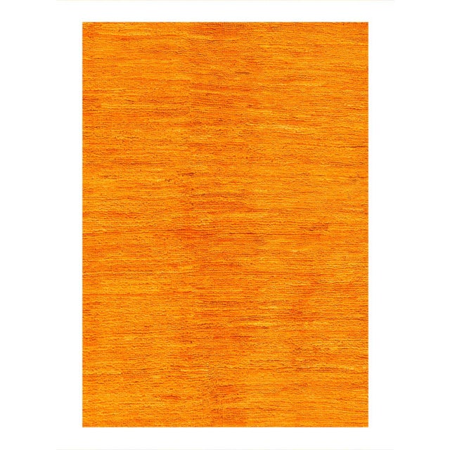 Hand knotted and meticulously crafted by Pakistani artisans, this stunning Overdyed Gold color Hand Knotted Area Rug...