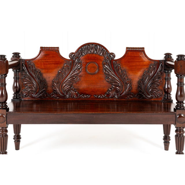 A 19th Century Mahogany Hall Bench/Window Seat This lovely bench is executed in finely carved mahogany, the shaped back...