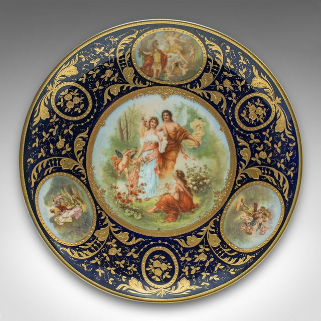 This is an antique wall charger. An Austrian, gilt ceramic decorative plate, dating to the late Victorian period, circa...