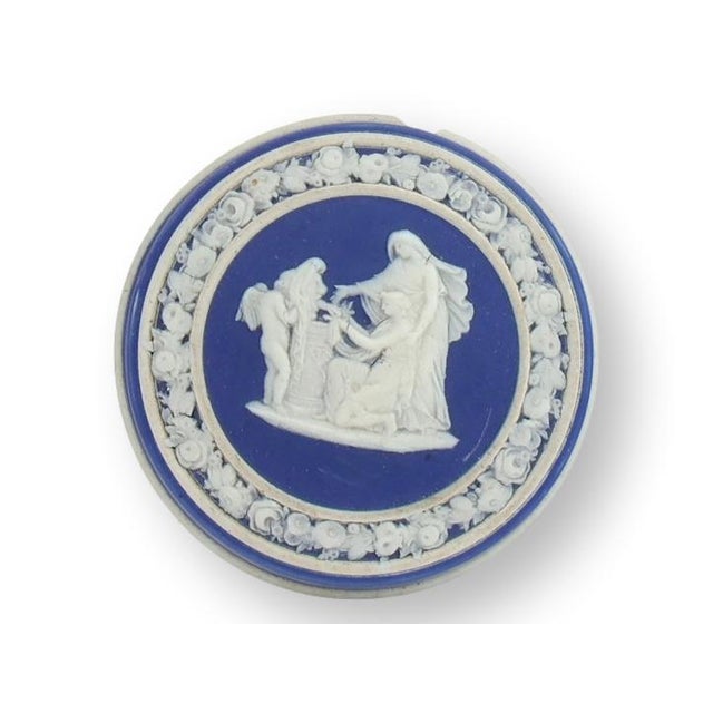 Elegant late nineteenth century Wedgwood Jasperware rouge pot in the iconic cobalt blue and white colorway. Decorated with...