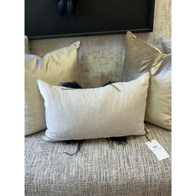 Blending textures and natural materials, our pillow is embellished with a band of ostrich shin leather trimmed with navy...