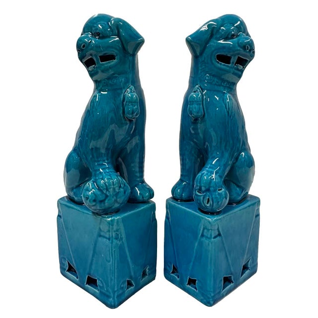 This magnificent pair of Chinese Turquoise Glazed Ceramic Lion Statuary are hand made and hand carved in Museum quality....