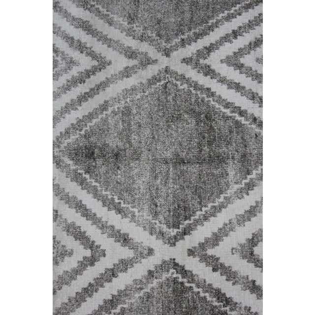 A beautiful handmade Bamboo silk rug. The geometric design woven in by Aara Rug hands. This rug is made of 75% bamboo silk...