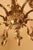 Large gilded bronze ten-arm chandelier in the classicist louis xvi style. The chandelier is elaborately detailed. High-...