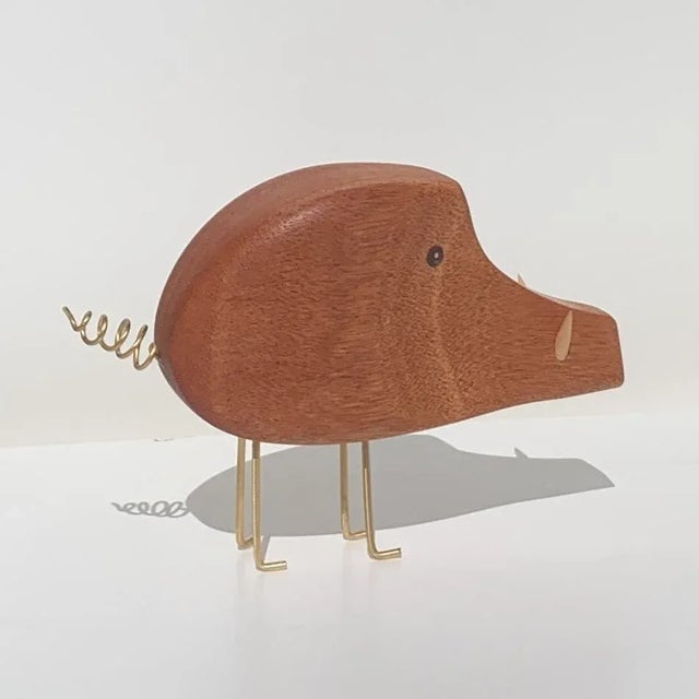 Mid Century Modern Mahogany Wild Boar created in the style of iconic Danish designer Jacob Hermann. The eyes are inlaid...