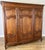 A beautiful Vintage French Louis style triple door wardrobe featuring elegant carved detailing, stunning oak grain and...