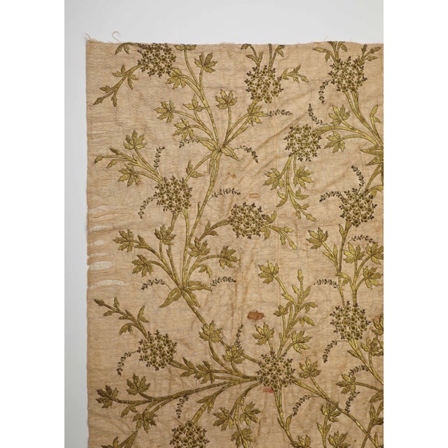Vintage textile embroidered with metallic thread, woven in a botanical pattern of a blossoming tree. Some thread...