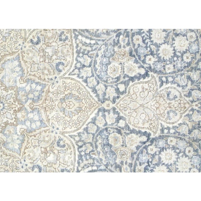 1940s Persian Tabriz Rug. Hand woven in the Tabriz region of Northern Iran. Distressed and refinished in the U.S. The...