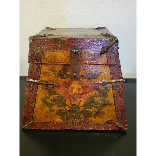 An exceptional piece of authentic Asian folk art, this antique Tibetan painted longevity box showcases an alluring...