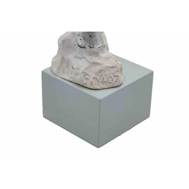 Body of woman is an original sculpture realized by Fabrizio Savi in the 2000s. Two bodies emerge from the plaster material...