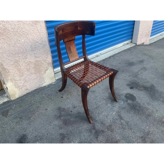 Klismos modern walnut chair. Chair is made of solid walnut and have a natural walnut finish. Chair is in beautiful...