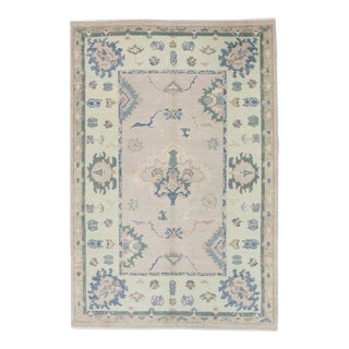 Early 21st Century Soft Pink Handwoven Wool Turkish Oushak Rug in Blue Floral Pattern 4'11" X 7' For Sale
