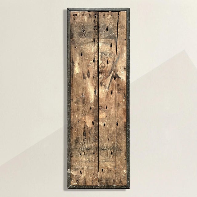 A captivating and intriguing early 20th century Southern American folk art panel, found in Mississippi, depicting a figure...