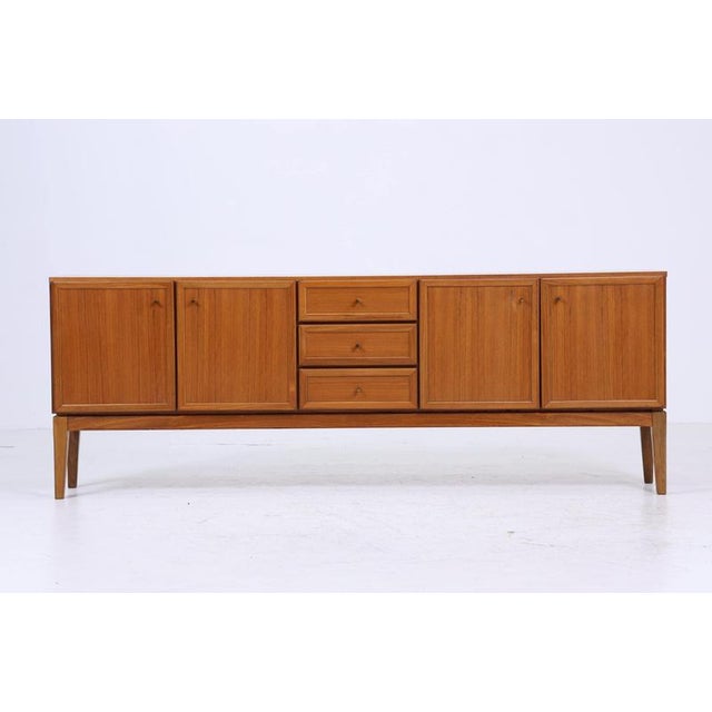 Beautiful sideboard from the 60s with compartments and drawers made of teak * High-quality workmanship * Material: teak *...