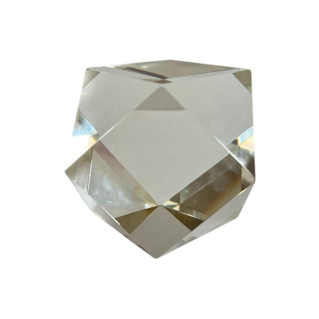 Mesmerizing solid crystal / glass geometric paperweight made up of 6 square sides and 8 triangular sides. Reflects light...